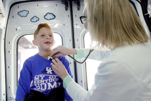 Nurse listening to child's heart Nurse listening to child's heart